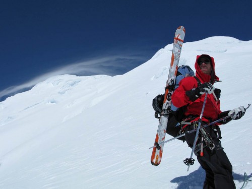 Courtney Phillips ponders his options as a lenticular cloud form on the 12,800' peak of Mt. Crossen.