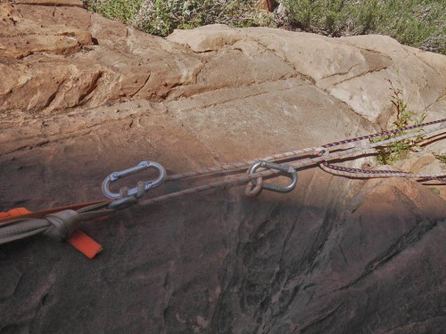 A biner-block rappel.  The top biner jams up against the rap ring, while the bottom one acts as a backup incase the upper biner should break.  In this case, we were rapping on the thicker line and using the thinner one as a pull cord.