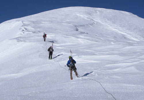 Nearing the summit of Sultana as a four-person team on a 60m rope.