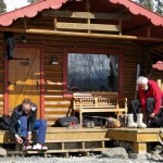Reto and Hombi gear up at one of the many cabins at the Ultima Thule Lodge. Reto and Hombi gear up at one of the many cabins at the Ultima Thule Lodge.
